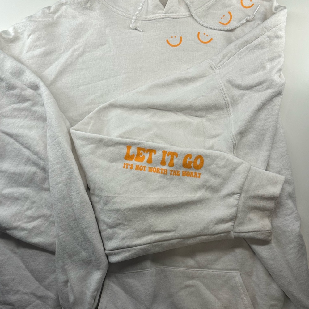 White Hoodie with Orange Smiley Faces and Text